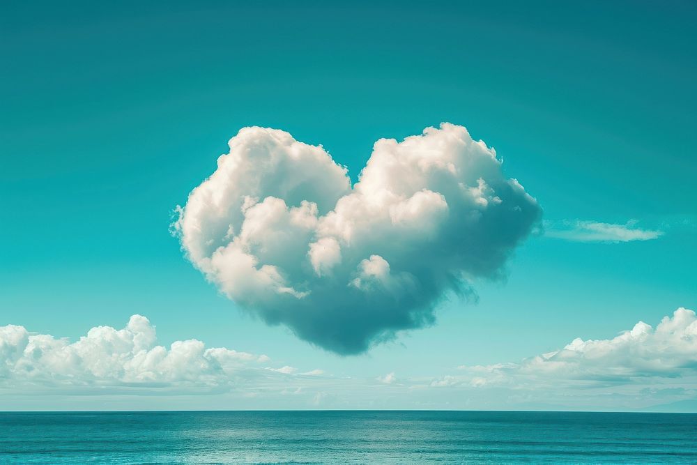 Heart shaped clouds in the sky over the sea outdoors horizon nature.