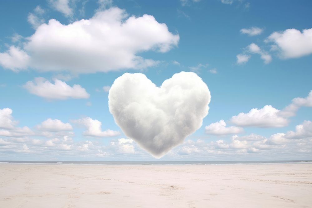 Heart shaped as a cloud in the sky beach background outdoors nature tranquility.