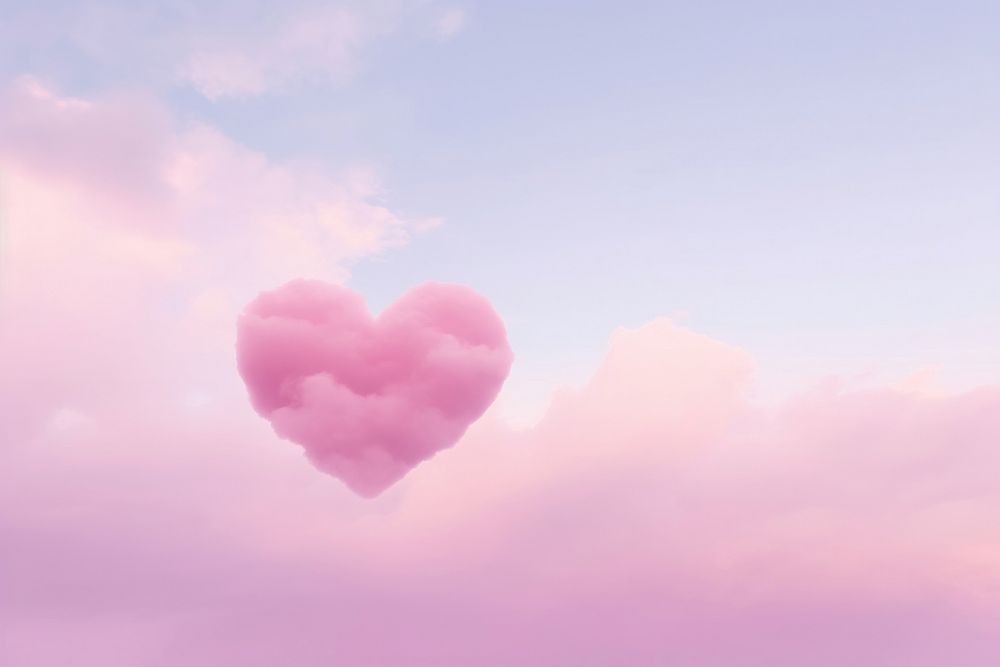 Heart shaped as a pink cloud backgrounds sky tranquility.