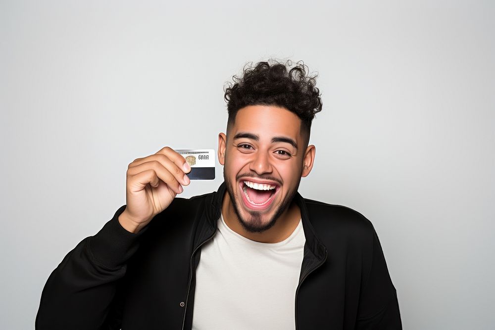 Man holding credit card smiling adult white background.