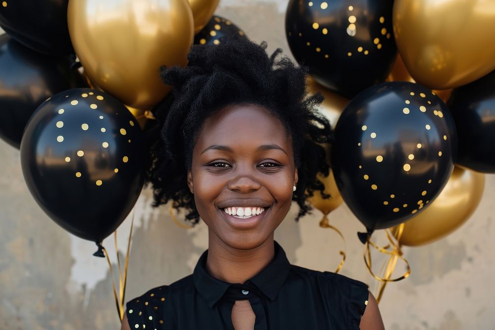 Black and gold party balloons birthday portrait smile.