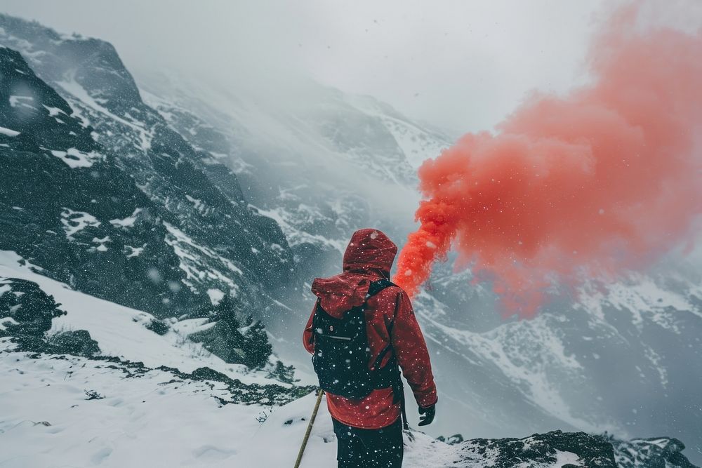 Hiker holding a distress signal flare mountain snow outdoors.