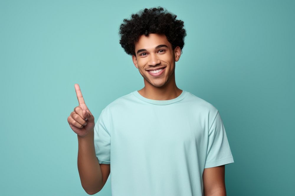 Mixed race man pointing smiling t-shirt. AI generated Image by rawpixel.