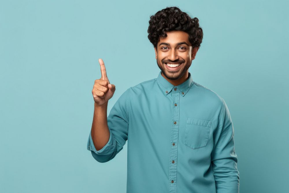 Indian man pointing smiling finger. AI generated Image by rawpixel.