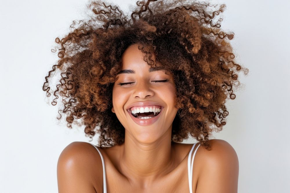 Afican american woman with white top laughing adult smile face.