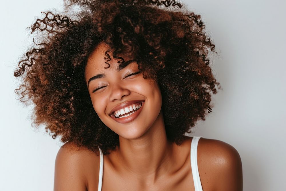 African american woman with white top laughing adult smile face.