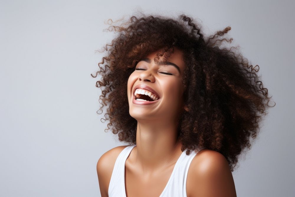 African american woman with white top laughing adult face perfection.