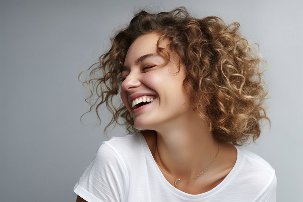 Casual woman with white top laughing smile adult face.