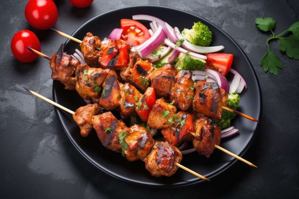 Chicken kebab skewers grilling plate meat.