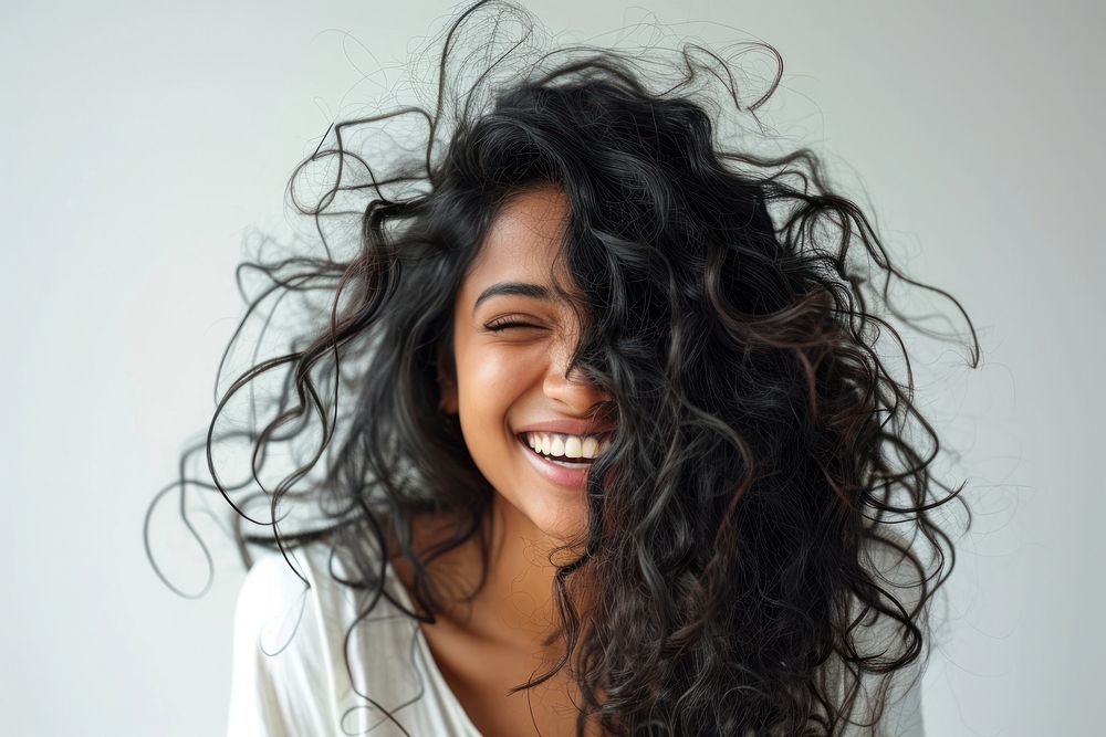 Indian woman with white top laughing adult smile face.