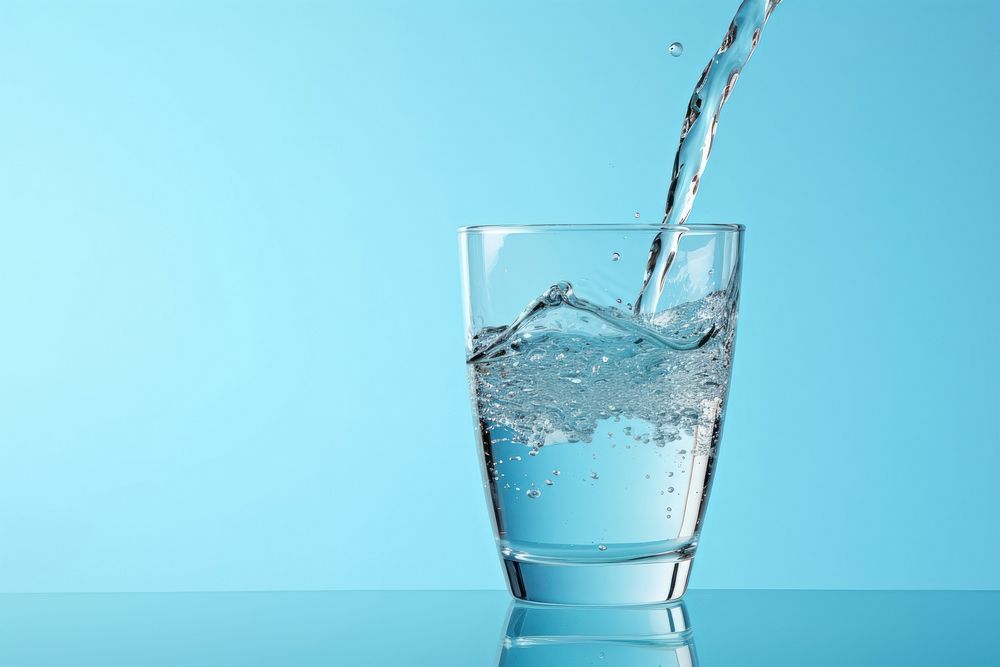 Pouring water glass blue blue background. AI generated Image by rawpixel.
