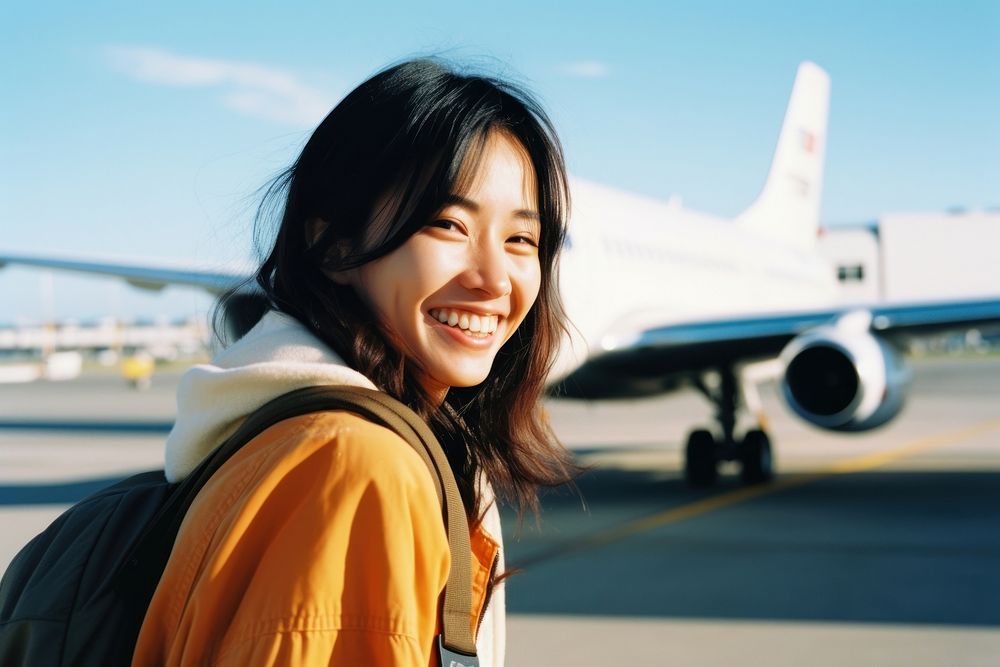 Asian woman smiling at airport photography airplane aircraft.