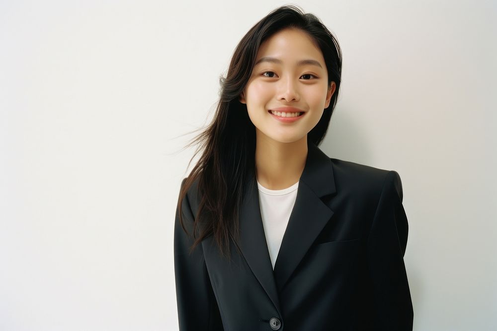 Asian woman in suit smiling and thinking photography portrait adult.
