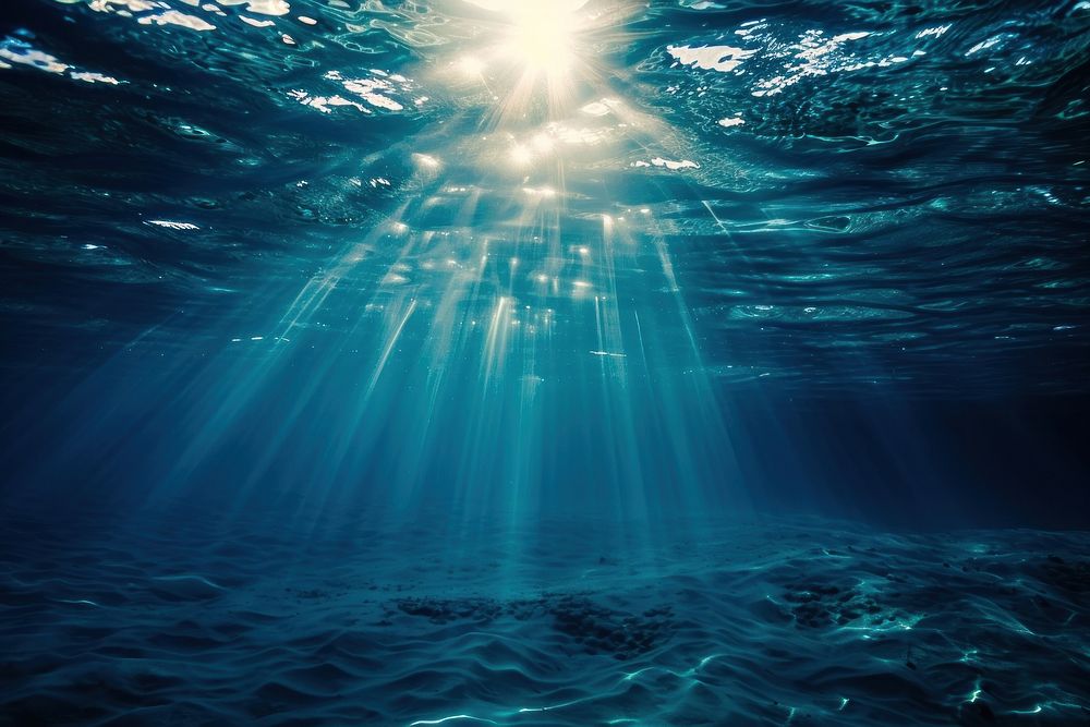 Surface of the ocean backgrounds underwater sunlight.