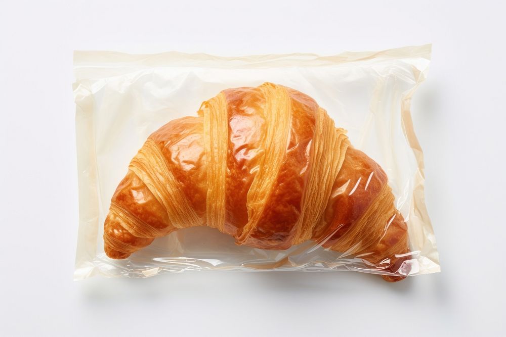 A croissant plastic bread food.