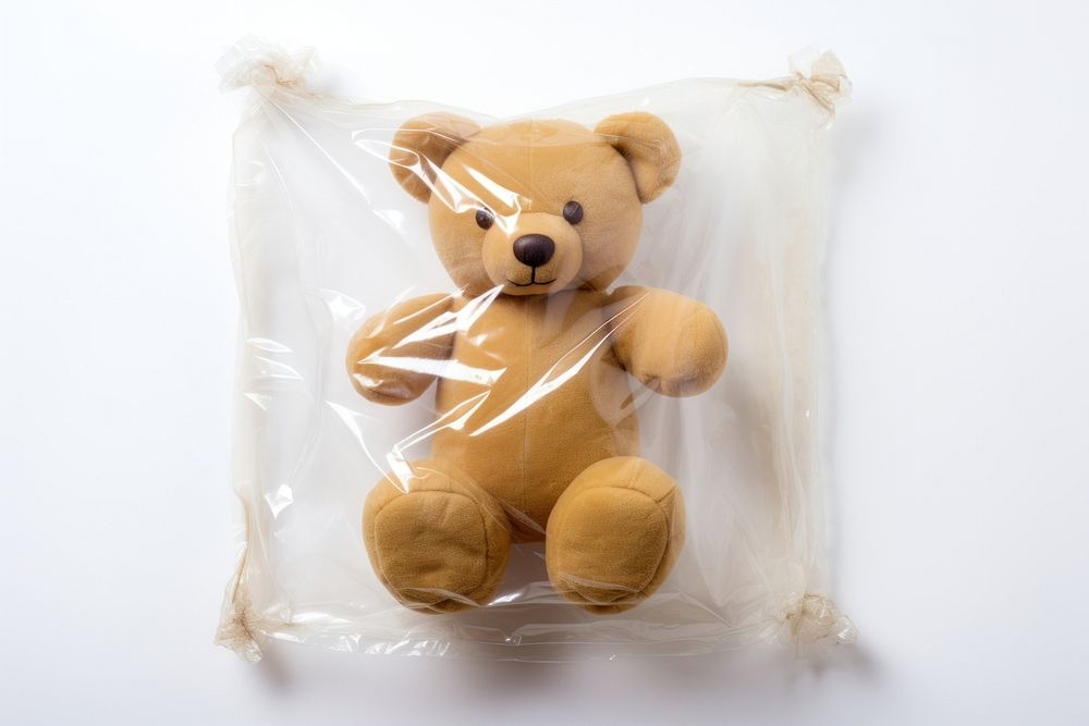 Teddy bear plastic toy white background.
