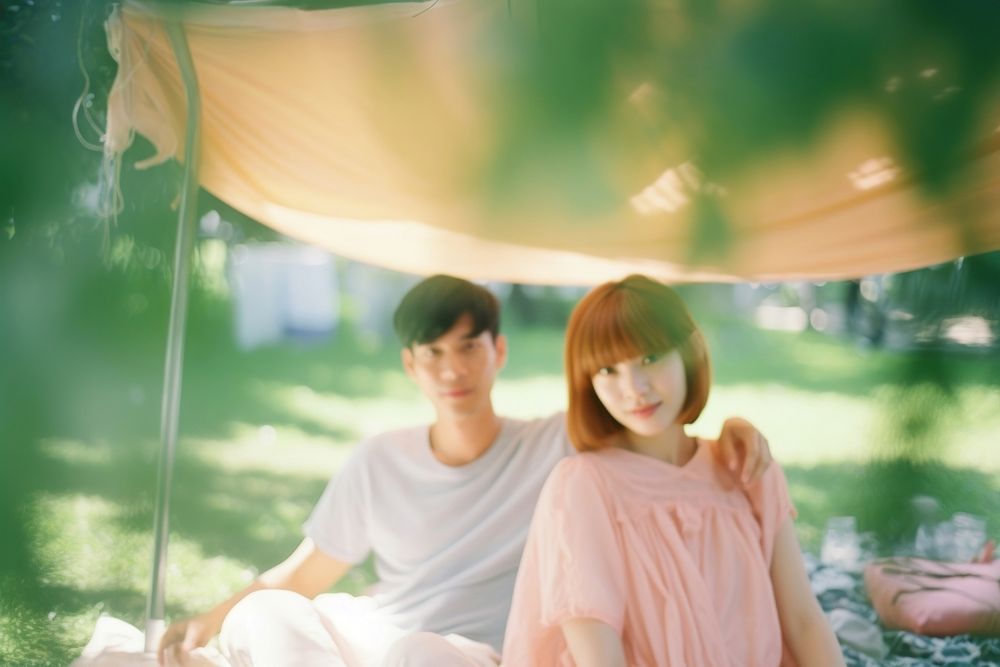 A couple in the garden picnic photography portrait outdoors. AI generated Image by rawpixel.