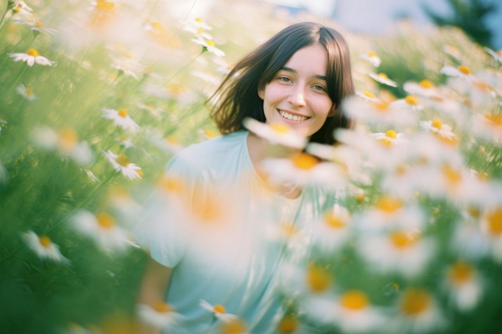A woman happy in the daisy garden photography portrait outdoors. AI generated Image by rawpixel.