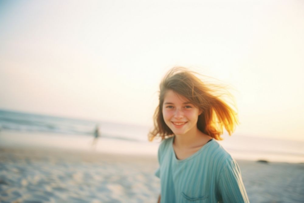 A teenage woman on the beach in summer photography portrait outdoors. AI generated Image by rawpixel.