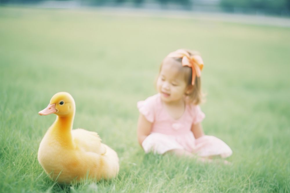 Babies duck with a kid happily photography portrait animal. AI generated Image by rawpixel.