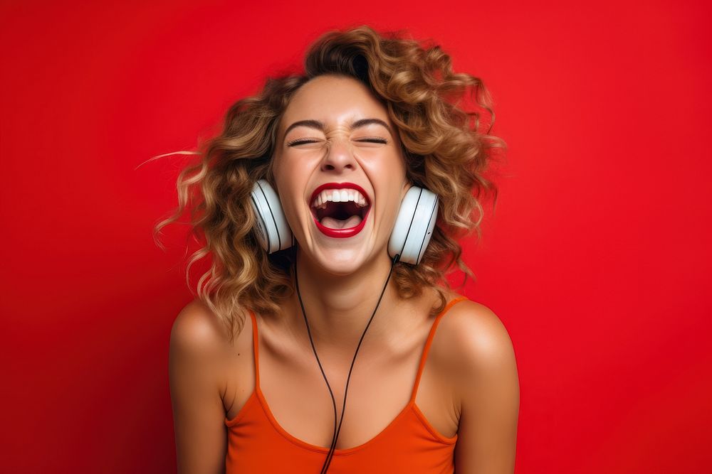 Laughing young white woman headphones shouting adult.