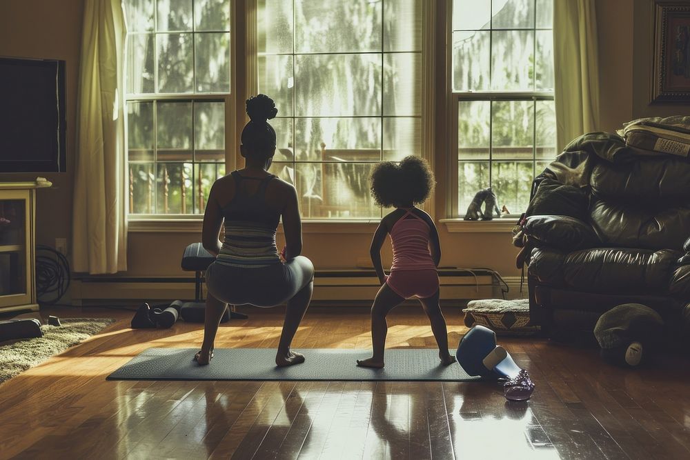 Mother and daughter engaged sports adult yoga.