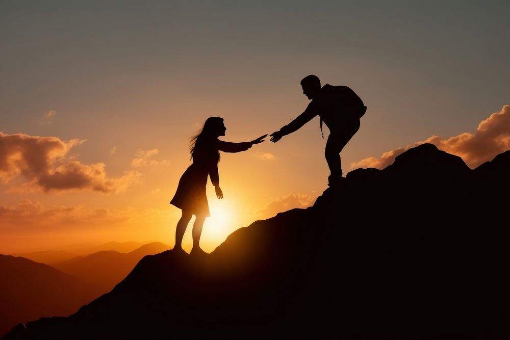 A man reaching his hand to grab a woman on the mountain backlighting silhouette sunset. AI generated Image by rawpixel.