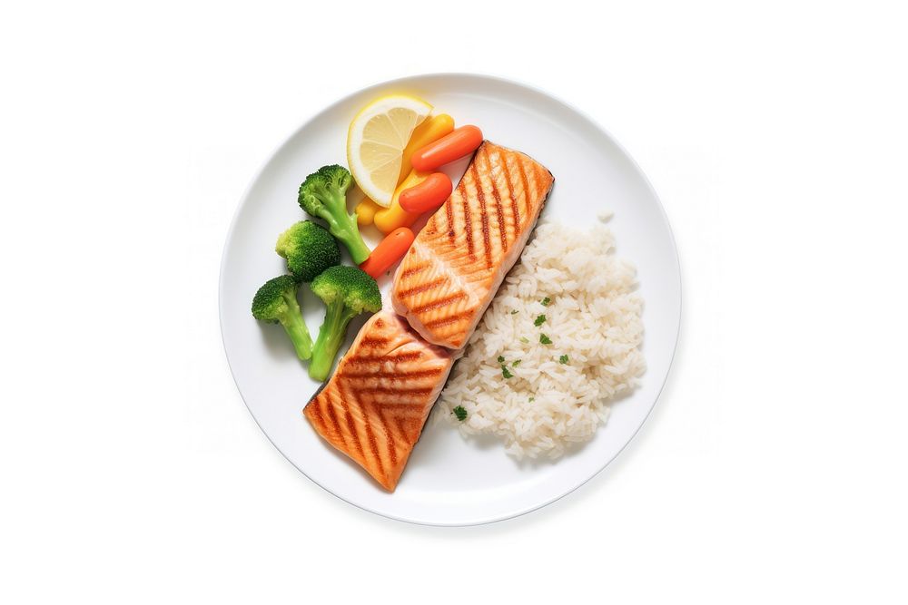 A salmon steak with rice and boiled vegetables as a side an a slice of lemon on the white plate food seafood meat.