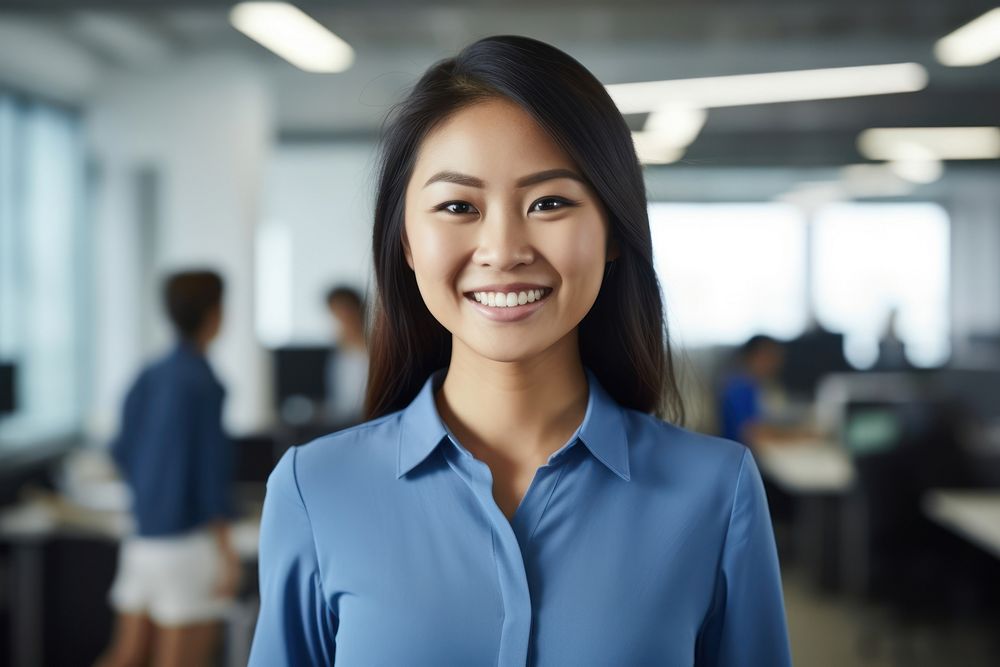 An asian woman smile in the office adult technology happiness. AI generated Image by rawpixel.