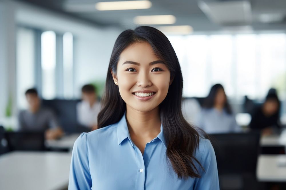 An asian woman smile in the office adult technology happiness. AI generated Image by rawpixel.