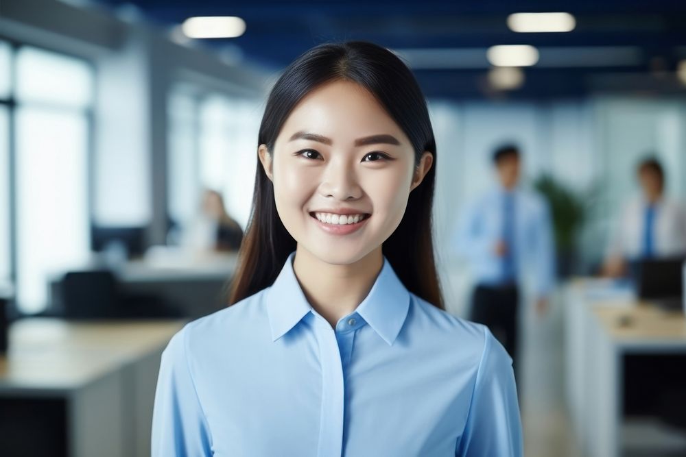 An asian woman smile in the office adult shirt technology. AI generated Image by rawpixel.
