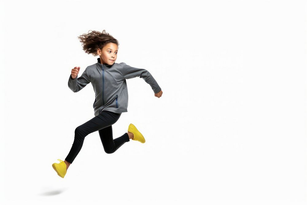 An eight year old wearing modern sport cloth running recreation jumping sports.