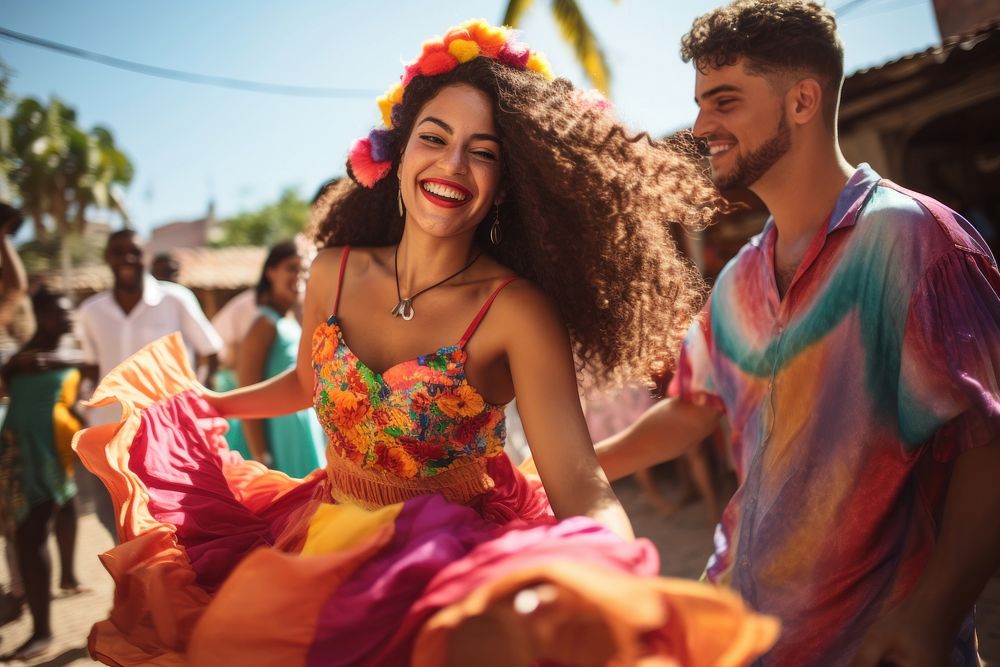 Latina and Latino in colorful costumes dancing celebration laughing adult.