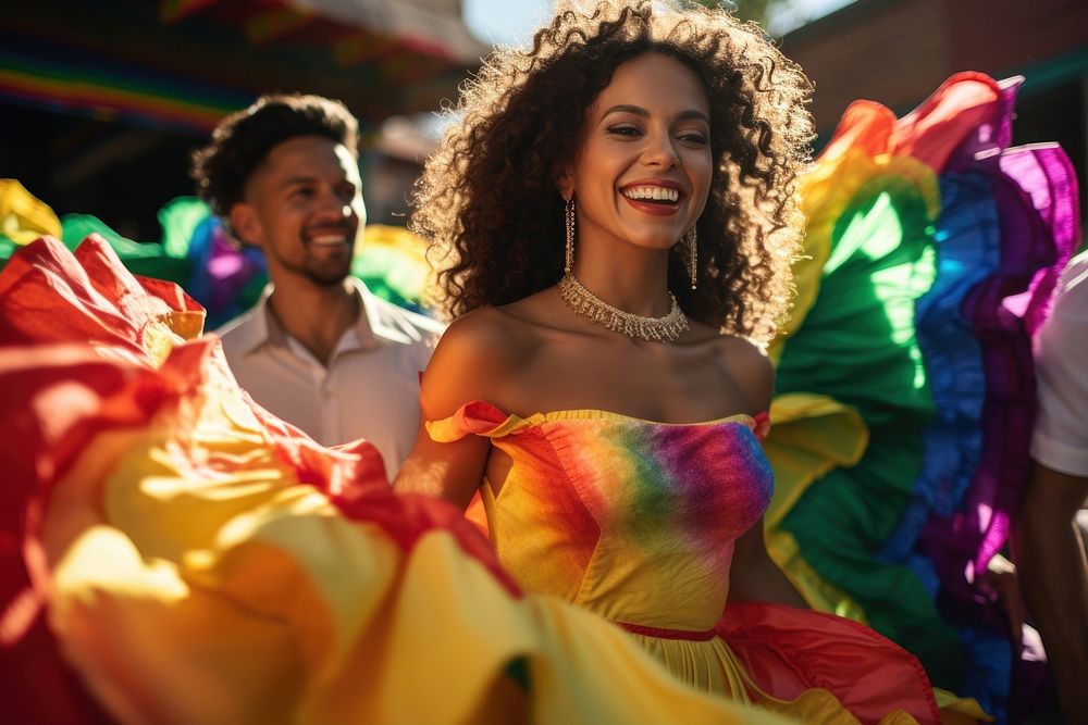 Latina and Latino in colorful costumes dancing celebration laughing carnival.