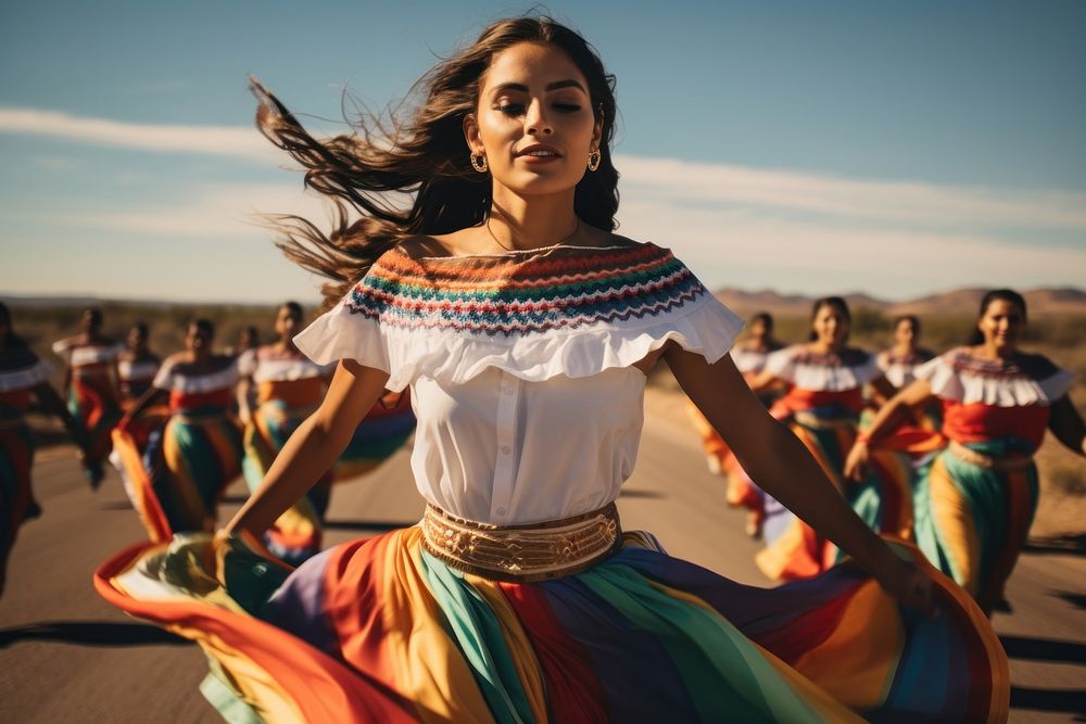 Mexican women dancer dressed with colorful skirts marching down a street in the country celebration dancing adult.