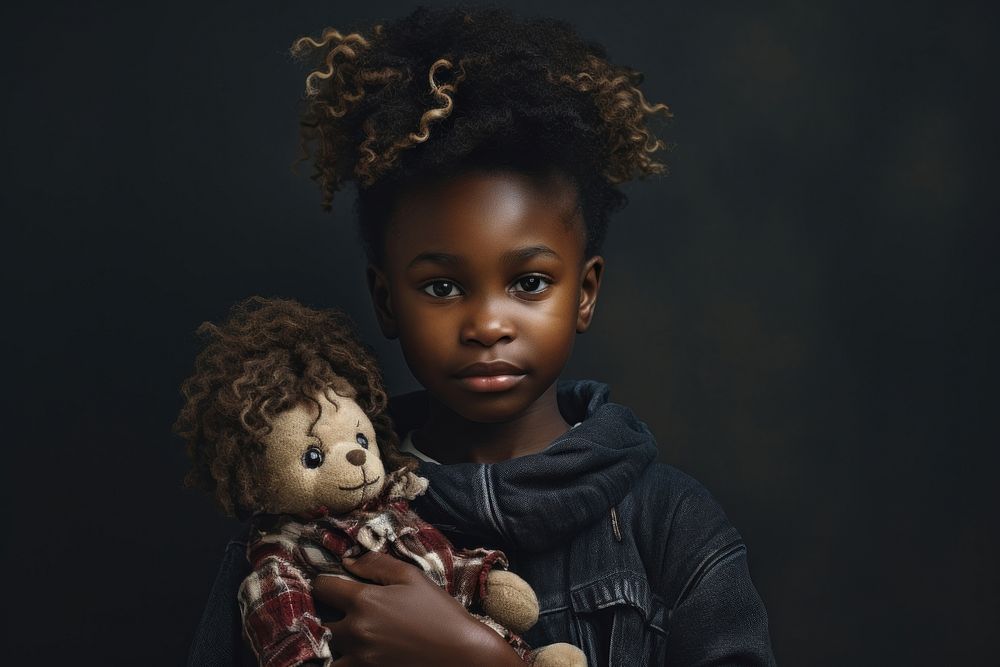 African student holding doll portrait photo baby.