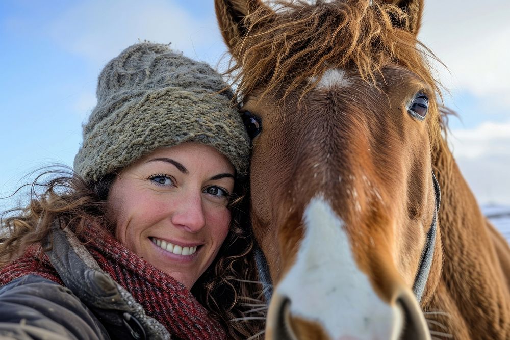 Horse and woman animal portrait outdoors.