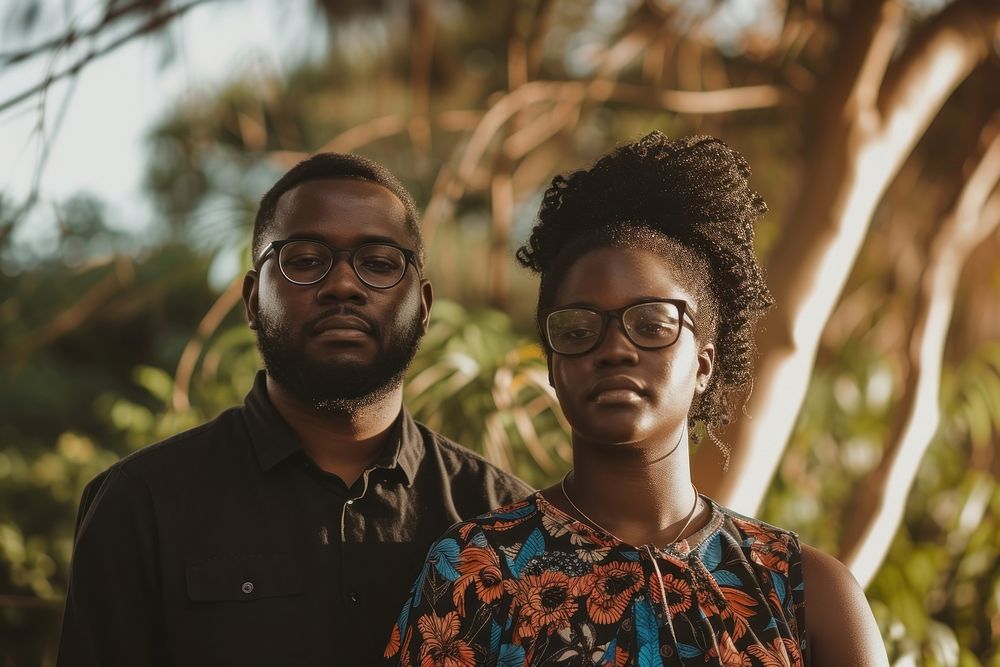 Black couple portrait standing glasses.