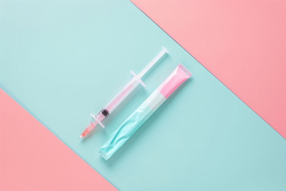 Syringe plastic studio shot toothbrush still life.