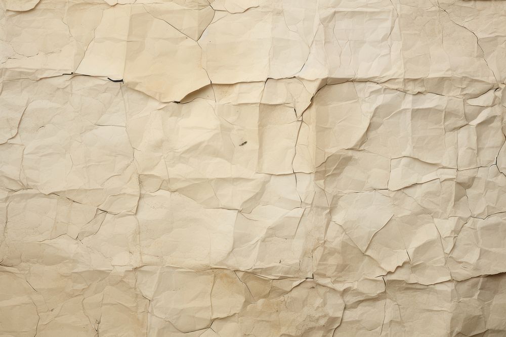 Crumpled glued paper backgrounds wall.