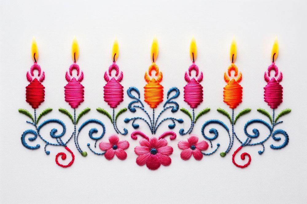 Embroidery of a candle border pattern art arrangement.