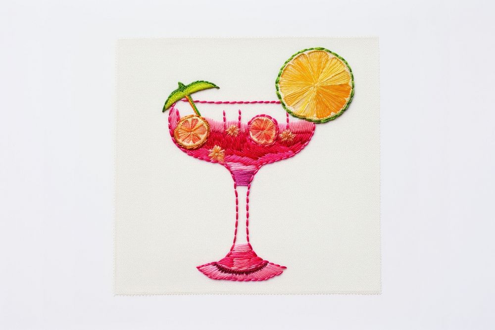 Embroidery of a cocktail border fruit drink glass.