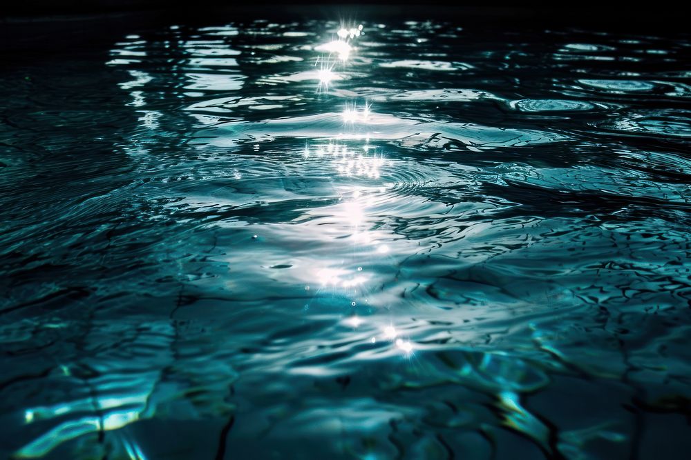 Transparent swimming pool sunlight reflections outdoors nature night.