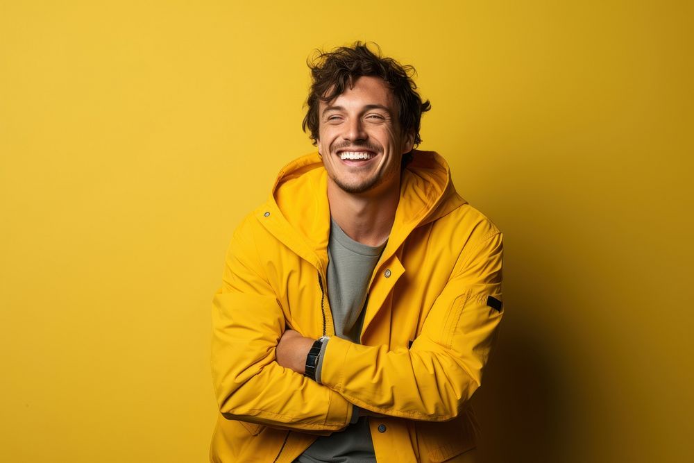 Man in yellow jacket laughing portrait smiling. AI generated Image by rawpixel.