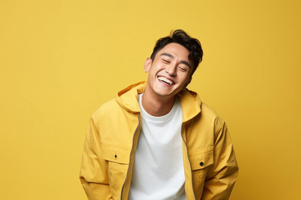 Man in yellow jacket portrait laughing smiling. AI generated Image by rawpixel.