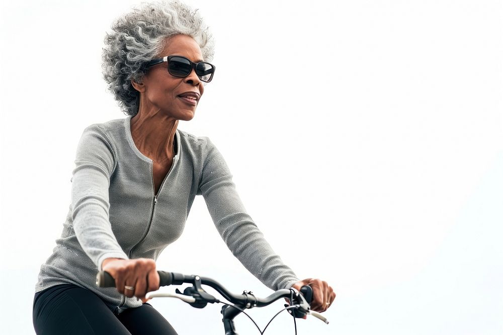Black mature woman cycling bicycle vehicle sports.