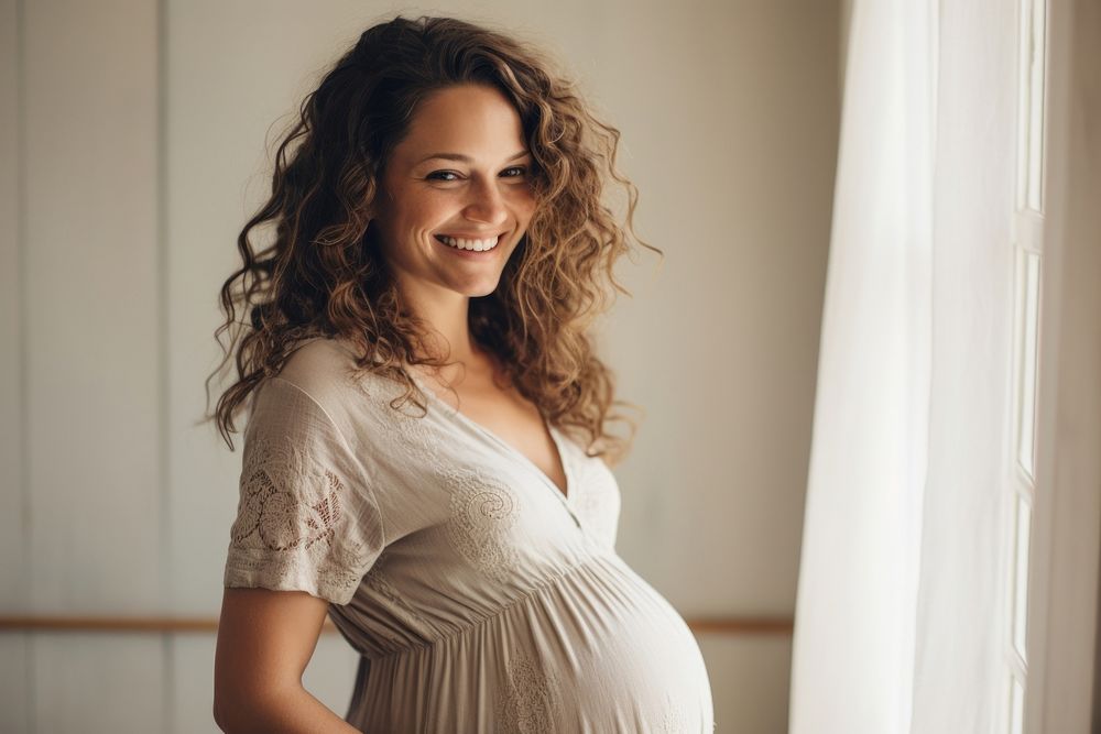 Happy Pregnant Woman smile pregnant standing.