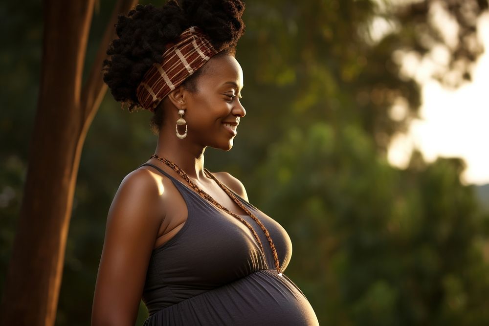 Happy Pregnant american african Woman is shy pregnant portrait adult.