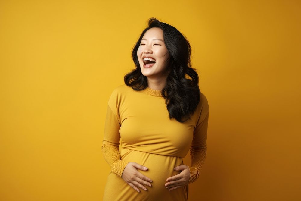 Happy Pregnant asian Woman pregnant laughing adult.