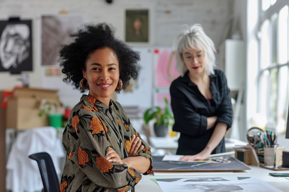Multi ethnic female designer at minial office adult entrepreneur togetherness.